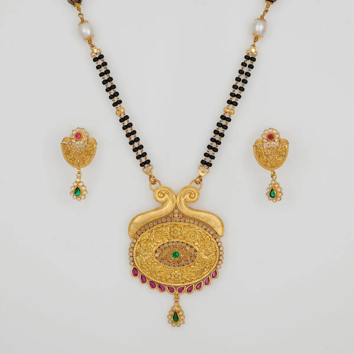 Adoreable Gold Mangal Sutra Pendant Set with Earring for Ladies in Beautiful Design